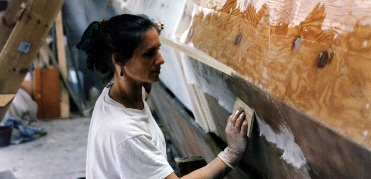 A woman working on a large boat