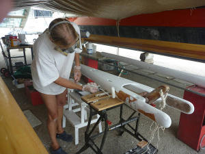 Hanneke working on gaffs and masts underneath Gaia