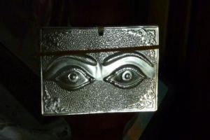 Silver plaque with eyes