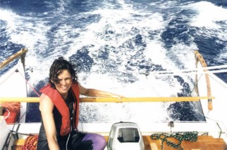 Tiki 21 cockpit, big waves, 1 woman, rear view
