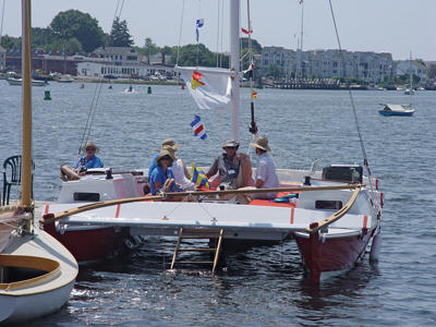 Wharram Catamaran with people aboard