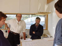 James having a discussion with visitors in the design studio