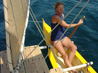 Hanneke at the helm of Tahiti Wayfarer