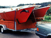 Tiki 21 being trailered by car