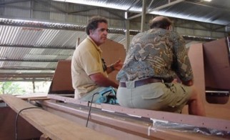 George and James on a boat in workshop