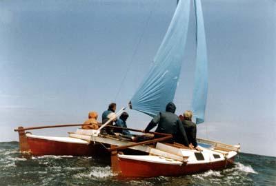 Sailing Tiki 21 with blue sail