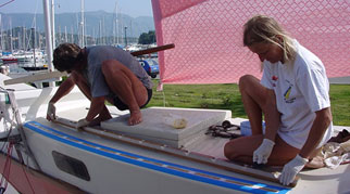 Hanneke and Michael working on a boat