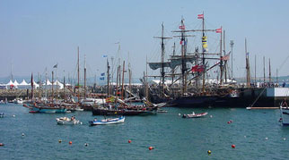 Many sailing ships in the harbour