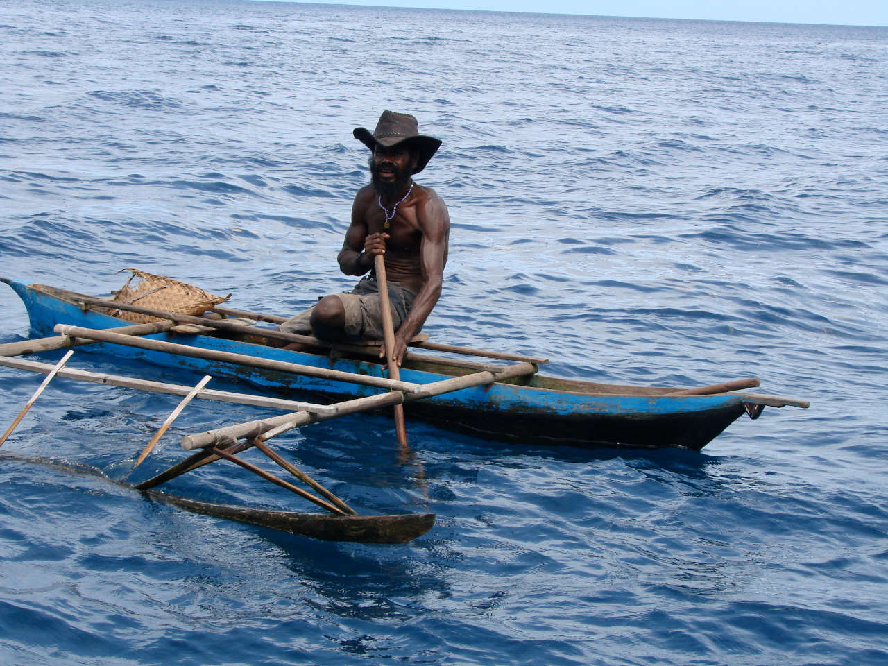 Local in an outrigger canoe