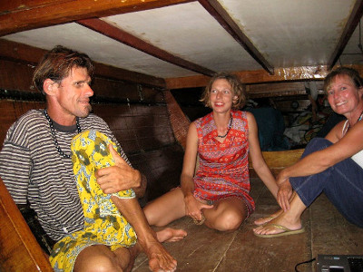 Three people in a boat cabin