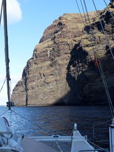 Hecate anchored next to huge cliffs