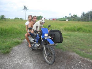 Bruno on motorbike with Charlotte and dog