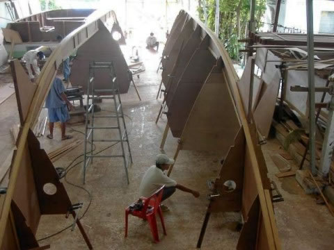 Partially completed Pahi 52 hulls flipped in a workshop