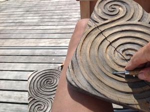Pieces of wood with swirly patterns carved in them