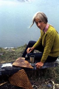 Hanneke making carved pieces of wood with spiral patterns