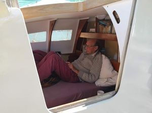 James reading a book in his cabin