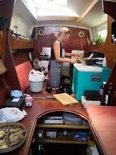Amanda cooking in the galley
