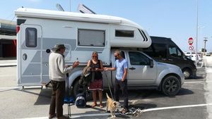 Paul, Amanda and James and Oscar the dog, outside a camper van