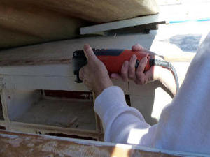 Hanneke cutting the edges of the deckpod panel