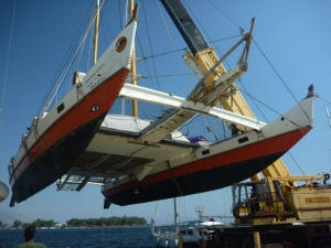 Gaia being lifted out the water by crane