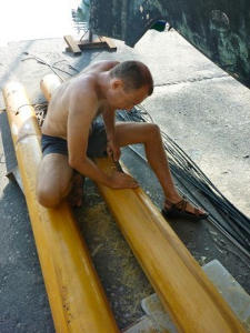 Frederik removing varnish from the masts