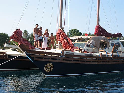 Islander 55 bow with people aboard