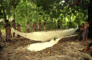 Many children with outrigger canoe