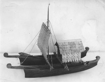 Double canoe model with sails and hut